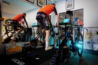 Chris Froome (Team Ineos) starts a Zwift session in his road bike, while his time-trial waits patiently for its turn