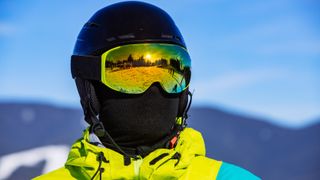 Man in snowboard mask helmet and balaclava