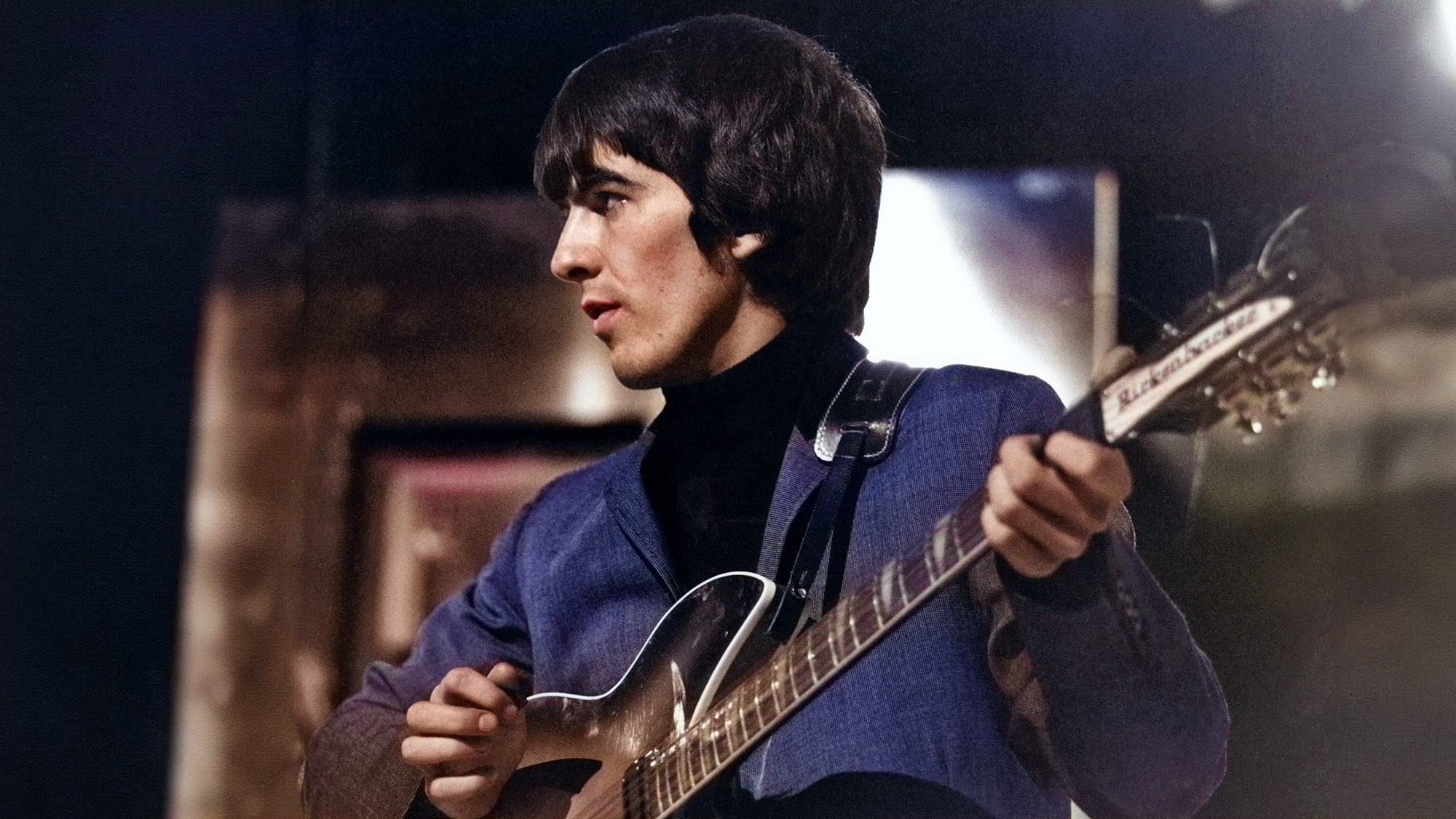 George Harrison of English rock and pop group The Beatles plays his 1963 Rickenbacker 360/12 guitar on stage during rehearsals for the ABC Television music television show &#039;Thank Your Lucky Stars&#039; Summer Spin at Teddington Studios in London on 11th July 1964. 