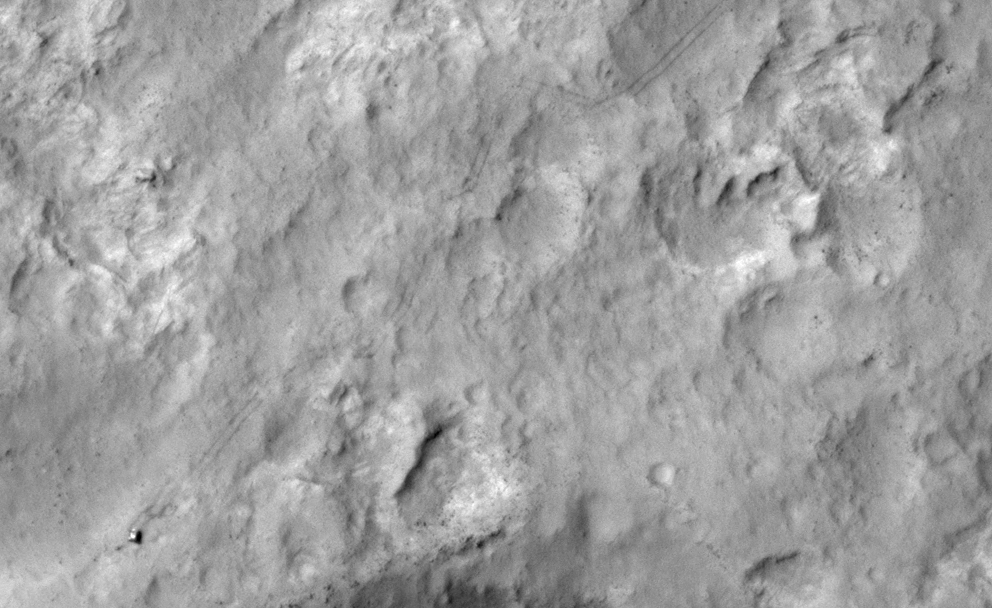 NASA&#039;s Curiosity Mars rover and tracks left by its driving appear in this portion of a Dec. 11, 2013, observation by the High Resolution Imaging Science Experiment (HiRISE) camera on NASA&#039;s Mars Reconnaissance Orbiter.