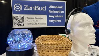 A styrofoam head models the ZenBud headphones at CES Unveiled 2024