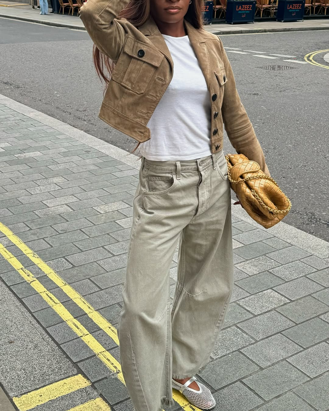 Woman wearing camel colored clothing summer 2025
