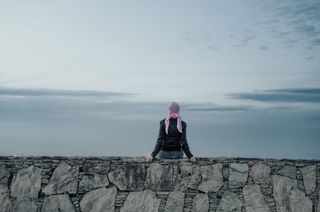 Cancer care: Woman in a pink headscarf