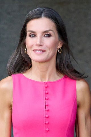 Queen Letizia of Spain is pictured with brunette hair - with a streak of grey - whilst visiting the Royal Theater during the NATO Summit on June 30, 2022 in Madrid, Spain.