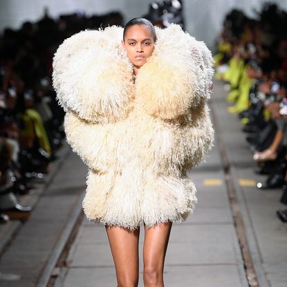 model wearing a cream shaggy short coat