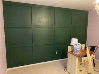 Creating a DIY wooden accent wall painted in green