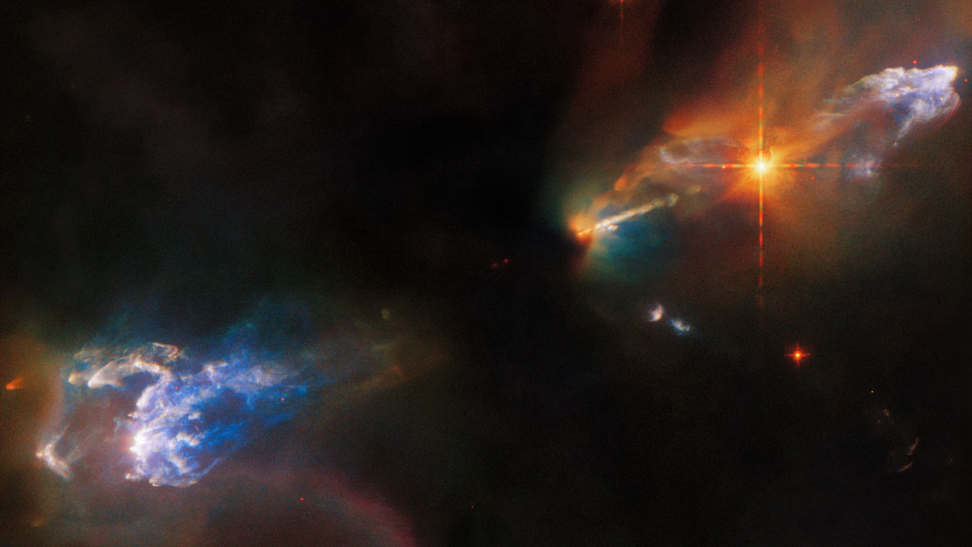 Newborn twin stars blast jets of rainbow-colored gas in Hubble image ...