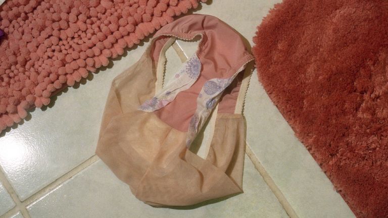 Underwear with Period Product On Floor - stock photo