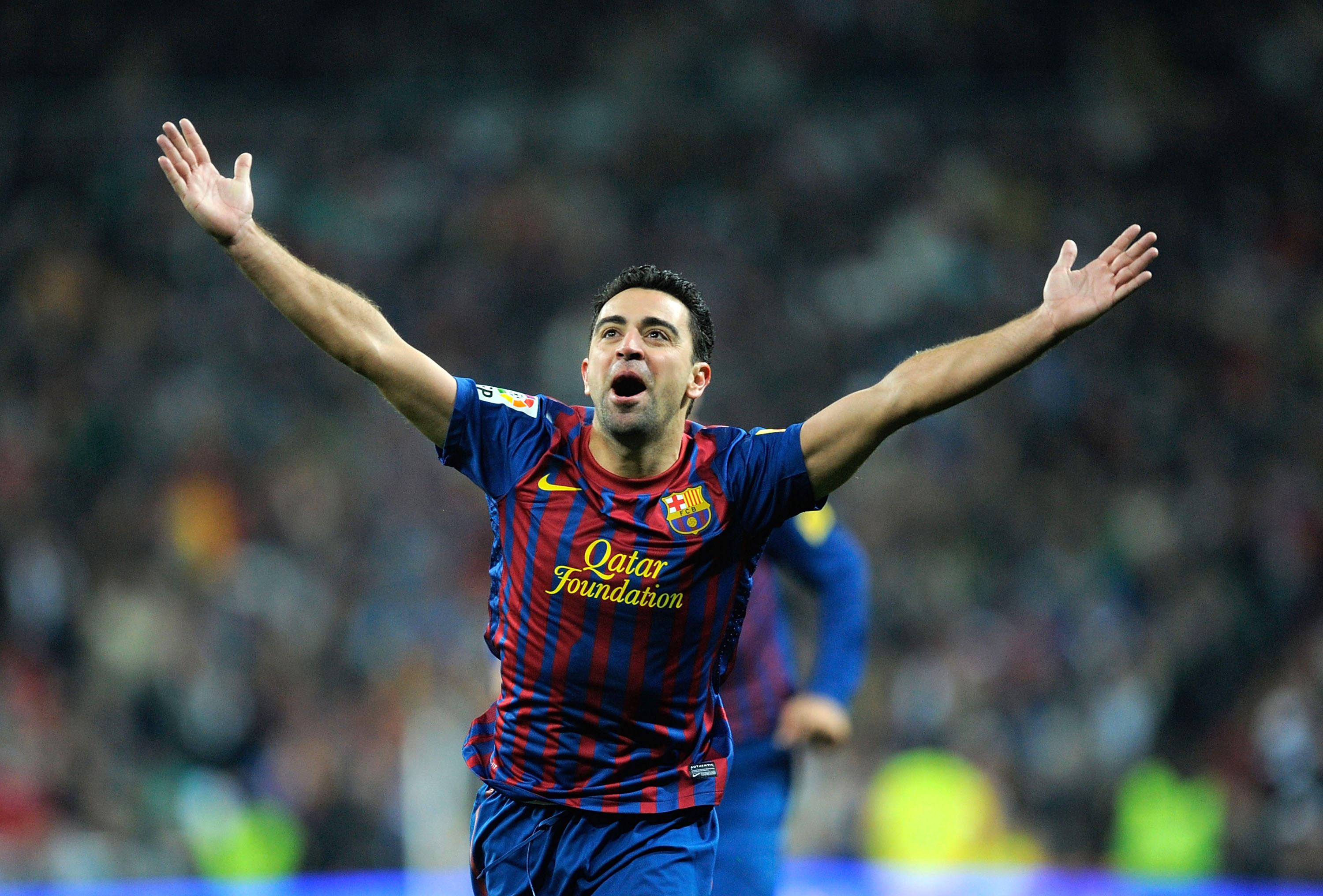 News Xavi celebrates after scoring for Barcelona in opposition to Genuine Madrid in December 2011.