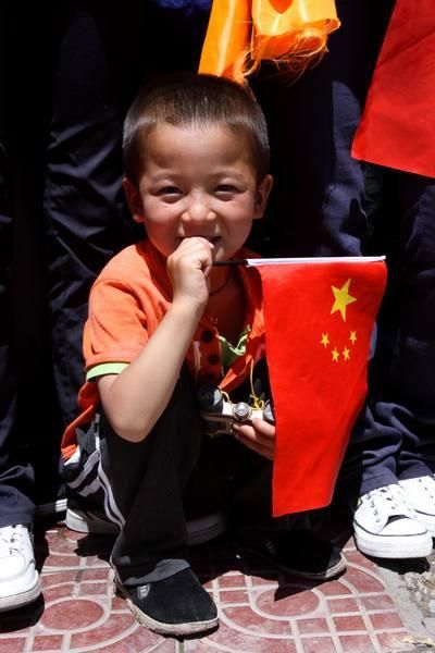 A young fan watches the action near the start area.