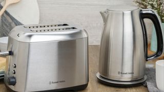 Carlton Kettle next to a toaster, sitting on a table