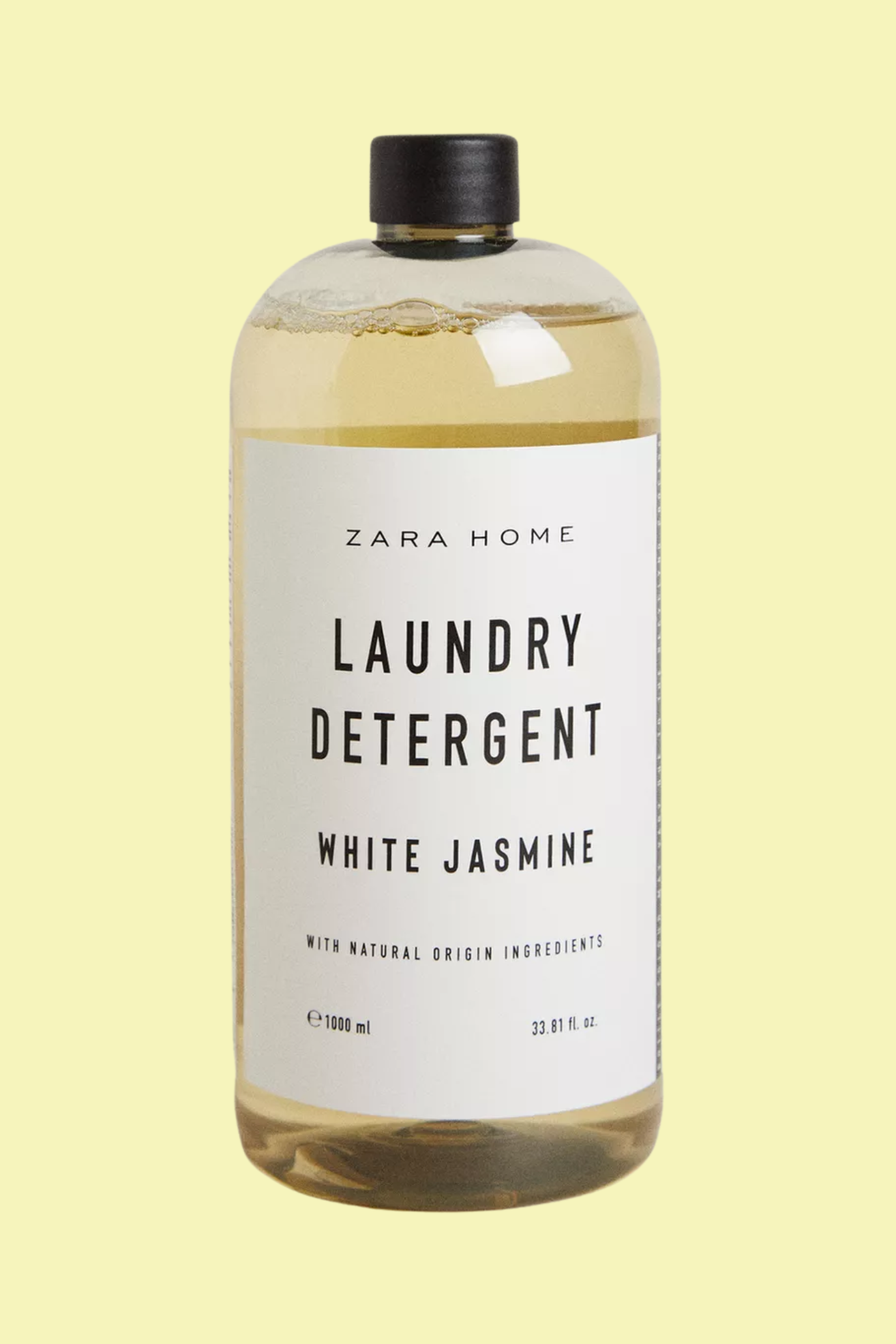 A bottle of laundry detergent against a light yellow background