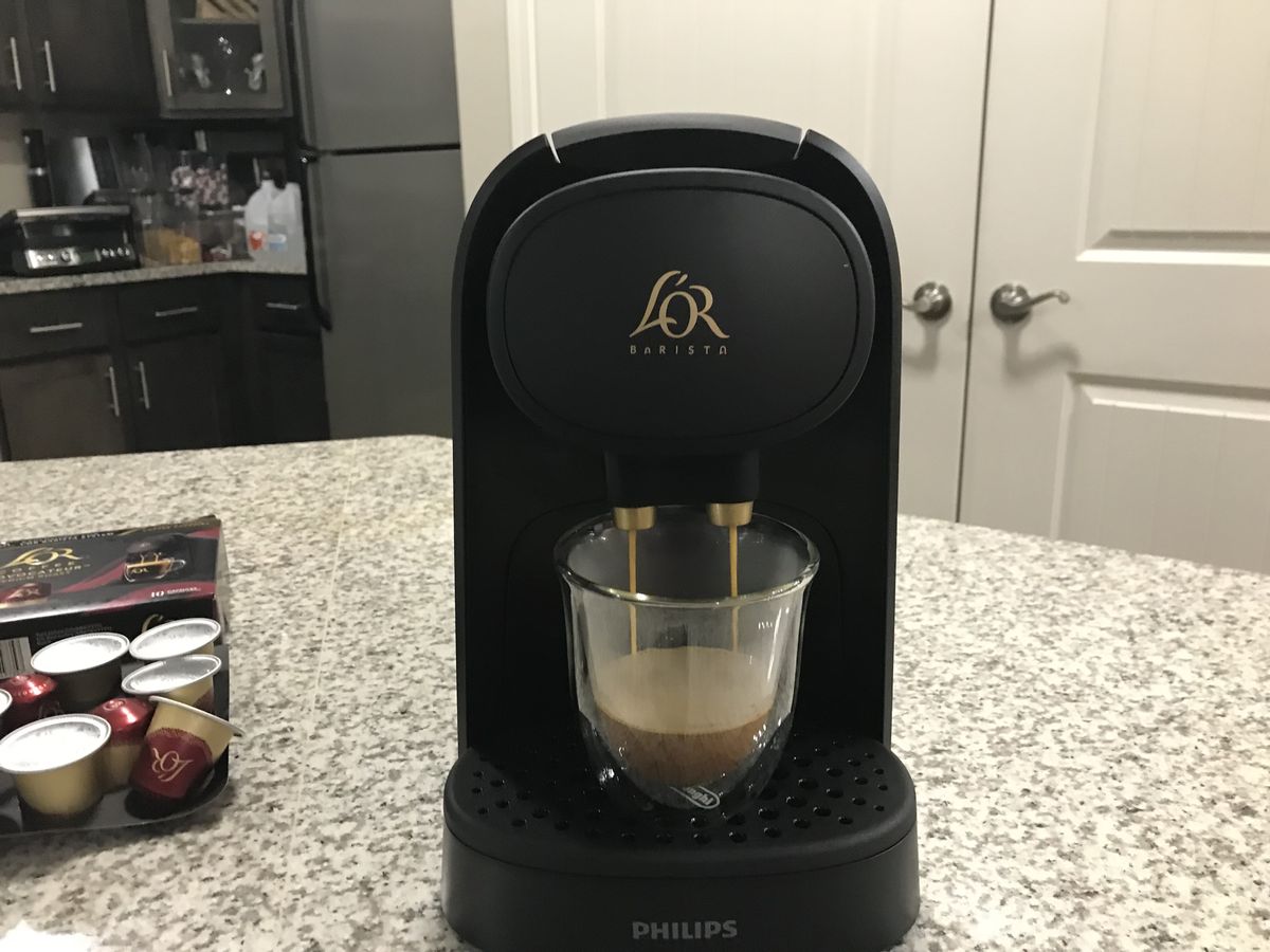 L'OR barista brewing a coffee