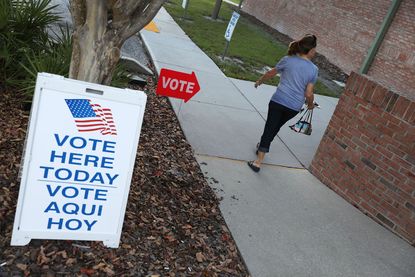 A voter arrives at a voting poll in Florida.