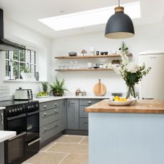 kitchen with grey cabinets and flower vase