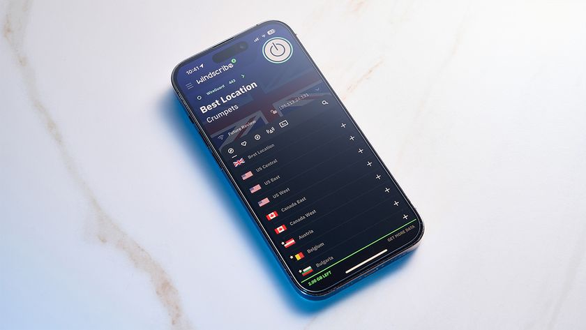 Windscribe VPN app open on an iPhone. The phone is laying down on a white, flat surface