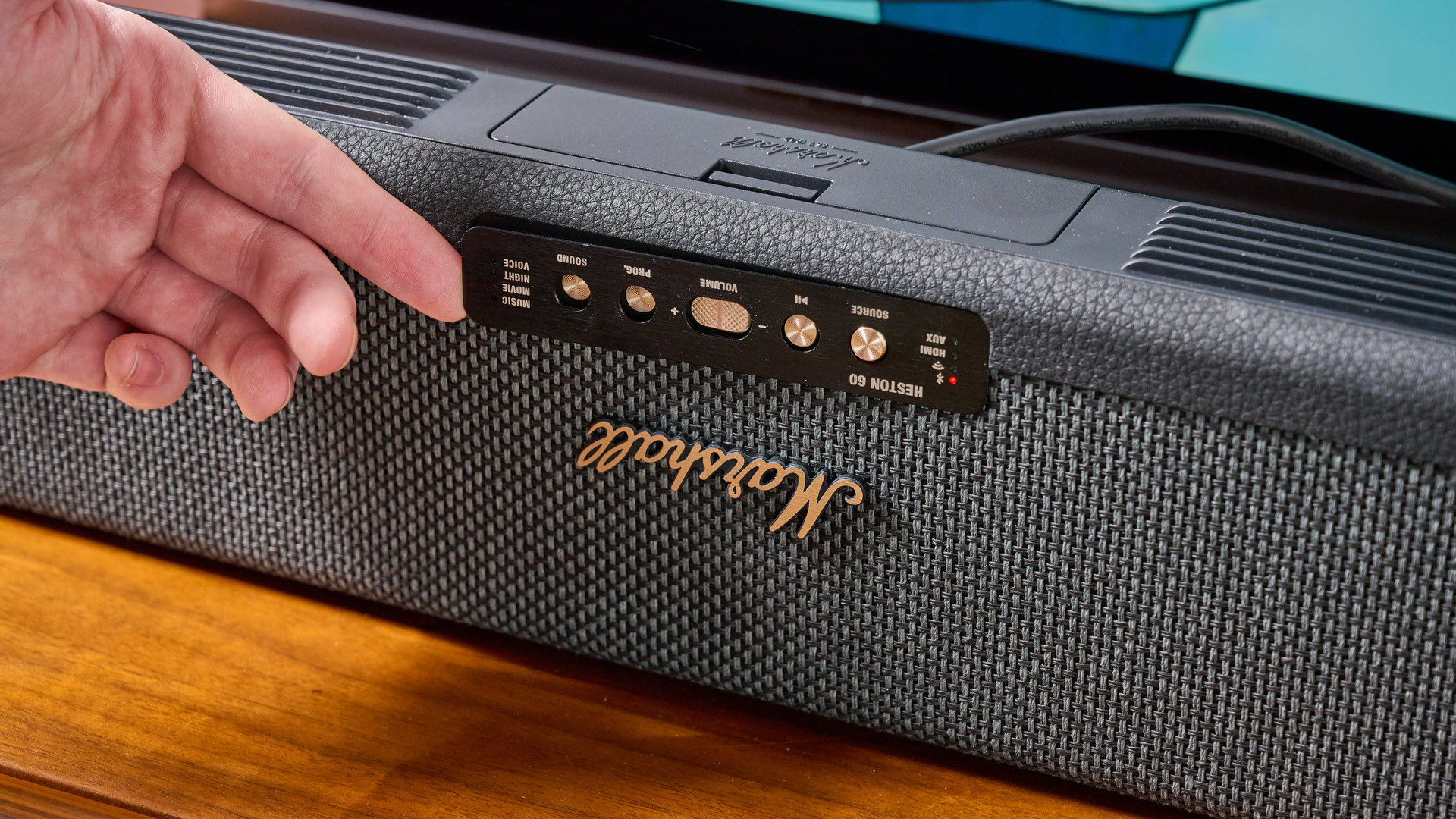 Person altering position of control panel on Marshall Heston 60