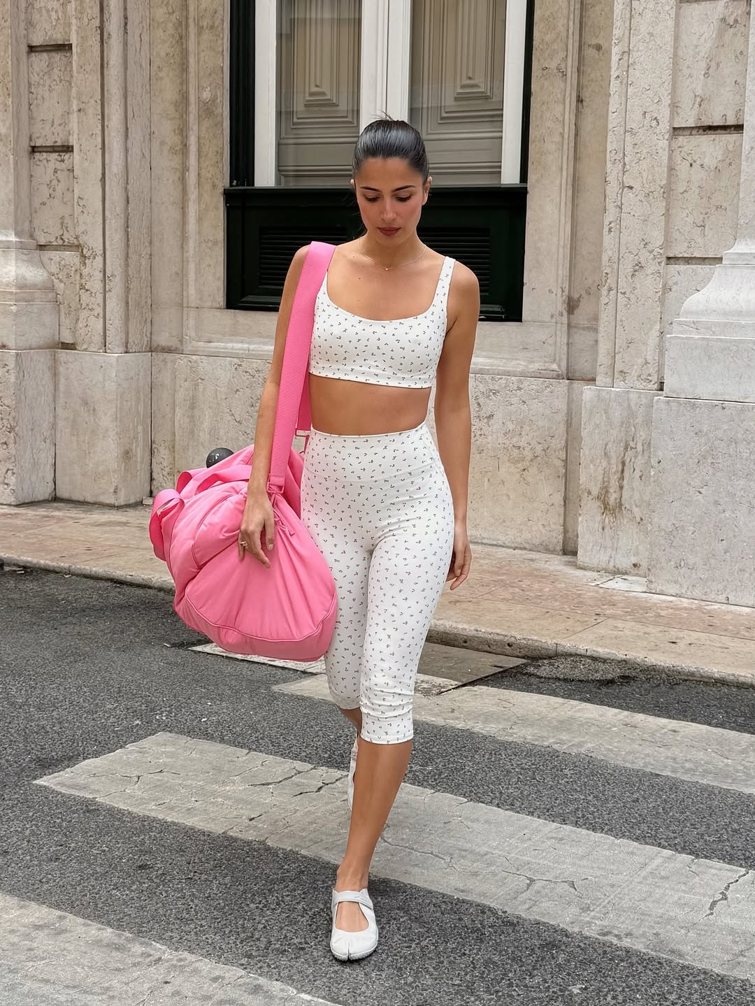 Tamara in white leggings with small pattern on them