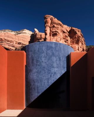 The brutalist exterior of a spa immersed in the Arizona desert.