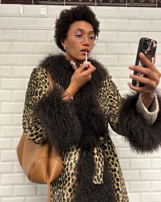 Influencer styles a leopard print coat.
