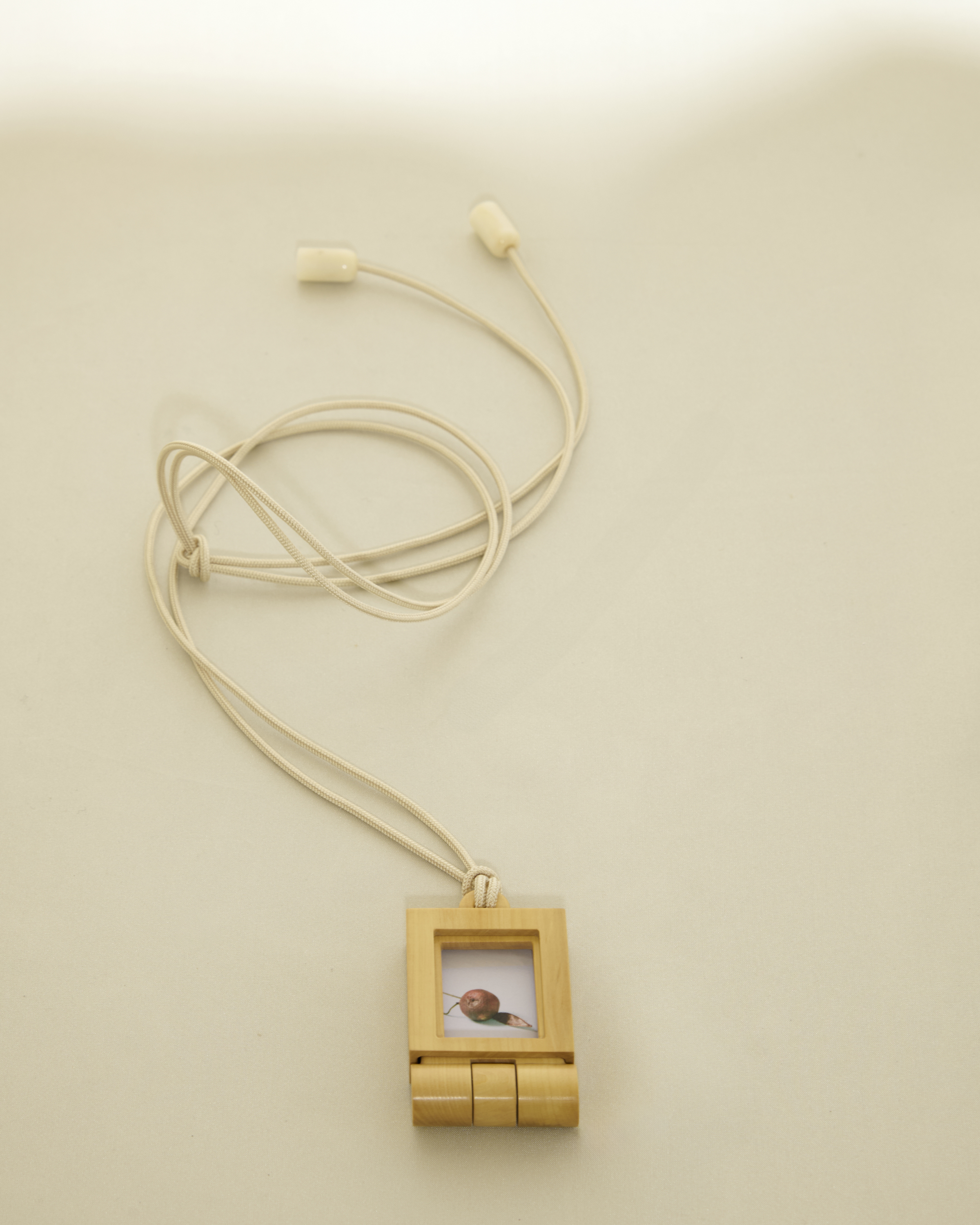 Small photo frame on a string