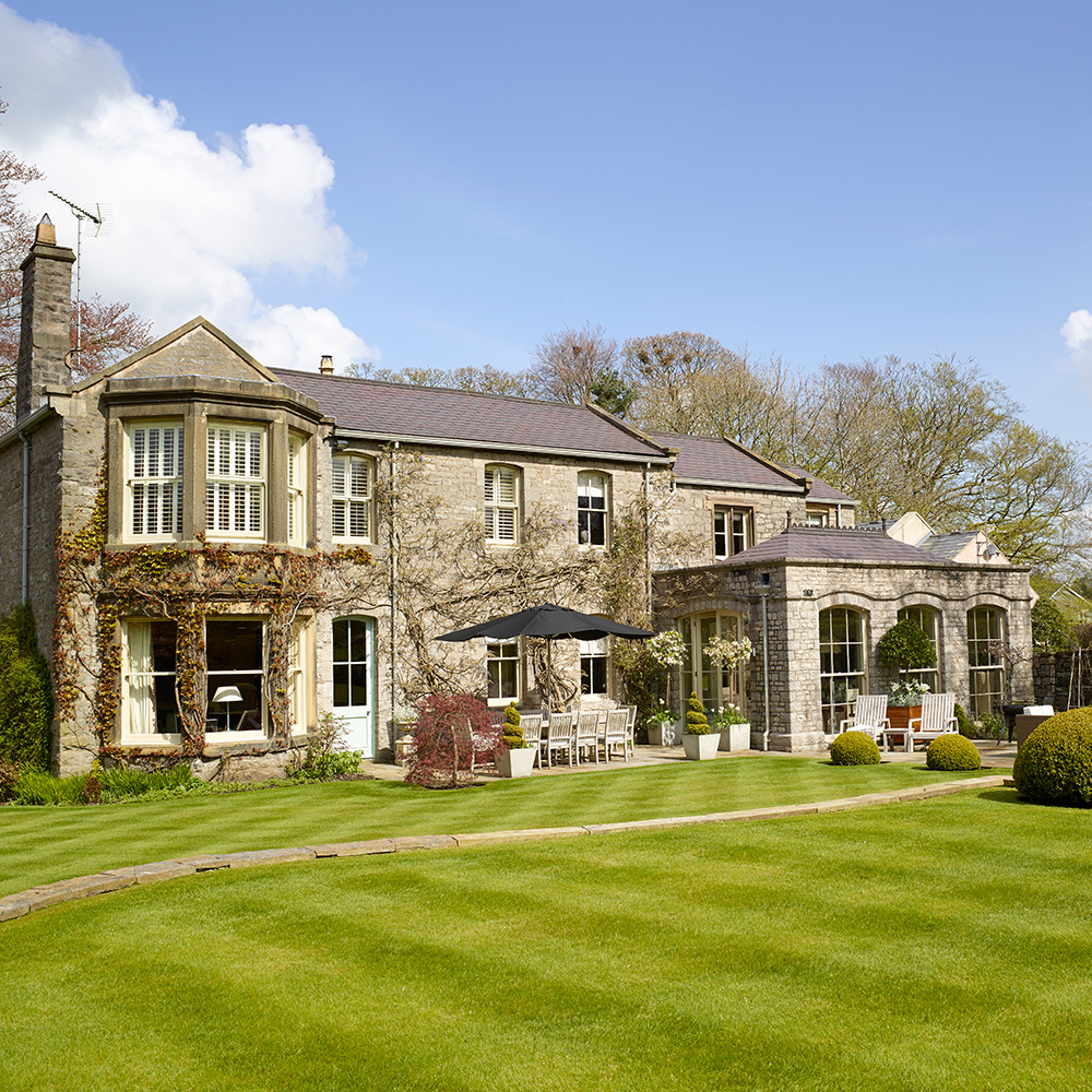 exterior of house with blue sky and green lawn