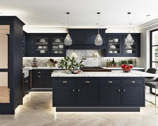 Kitchen lighting ideas with pendant lights over a blue island.