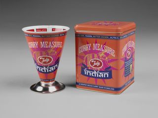 An orange and fuchsia cone and box with the words 'Curry Measure' written in white type