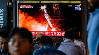 A television broadcast showing file footage of a North Korean launch, playing in a train station in Seoul, South Korea on May 28, 2024. The broadcast took place after North Korea announced it launched its Malligyong-1-1 spy satellite, but the rocket exploded during the mission.
