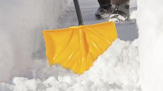 True Temper 18-Inch Pusher Poly Snow Shovel being used