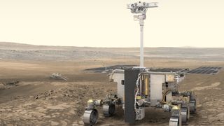 a four-wheeled rover on a reddish dusty surface