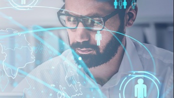 Whitepaper from Dell on upskilling your workforce with image of man's face with digital icons overlaid