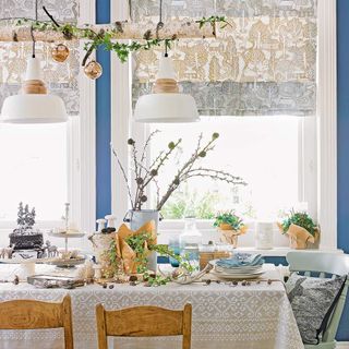 Christmas table decorated with branches and ivy