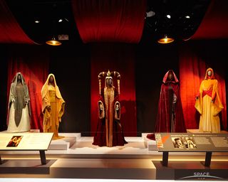 Many of the dresses worn by Queen Amidala in the "Star Wars" prequels are on display in Times Square, as part of a new costume exhibit.