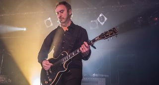 Doug Gillard plays a capo'd Les Paul onstage