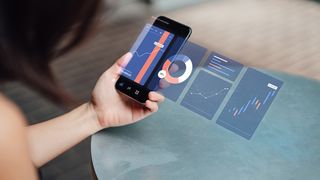 A woman uses an app on her phone to visualise data for UX theory
