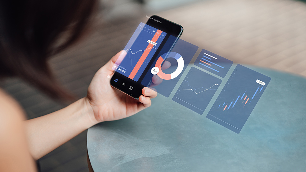 A woman uses a UI on her phone to visualise data