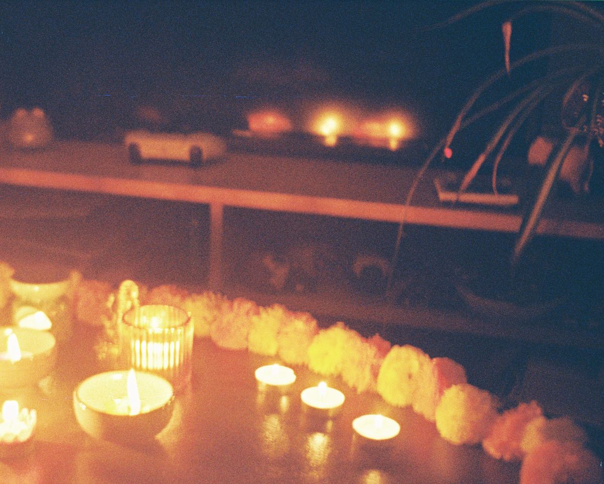 A photo of candles on a table, taken on a Lomography Lomomatic 110 film camera