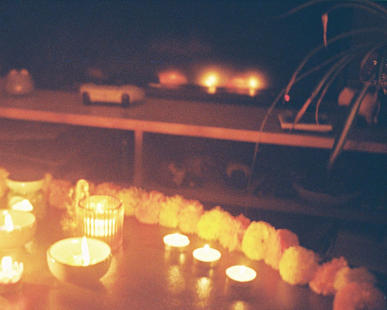 A photo of candles on a table, taken on a Lomography Lomomatic 110 film camera