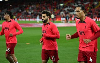 LIVERPOOL, ENGLAND - OCTOBER 29: (THE SUN OUT,THE SUN ON SUNDAY OUT ) Trent Alexander-Arnold of Liverpool and Virgil van Dijk of Liverpool with Mohamed Salah of Liverpool before the Premier League match between Liverpool FC and Leeds United at Anfield on October 29, 2022 in Liverpool, England. (Photo by Andrew Powell/Liverpool FC via Getty Images)