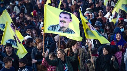 PKK supporters wave flags of founder Abdullah Ocalan
