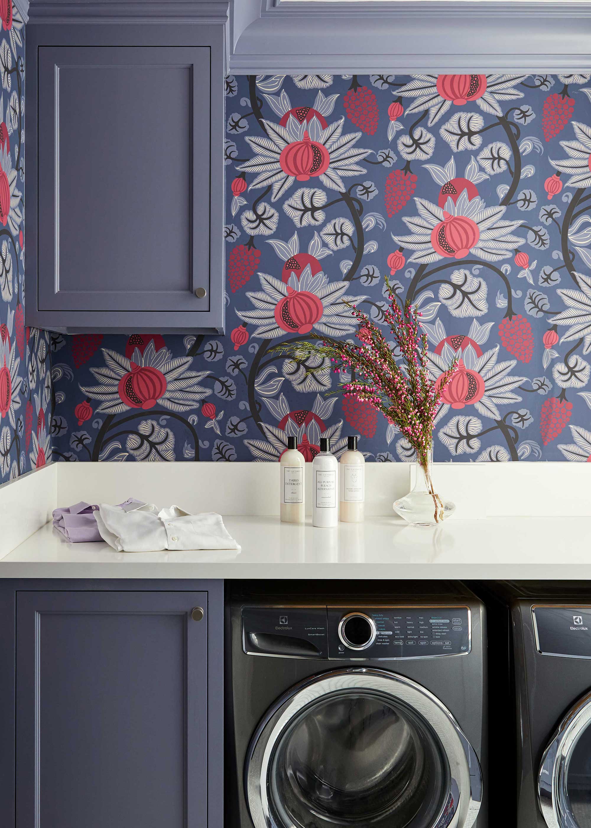 blue laundry room with botanical wallpaper