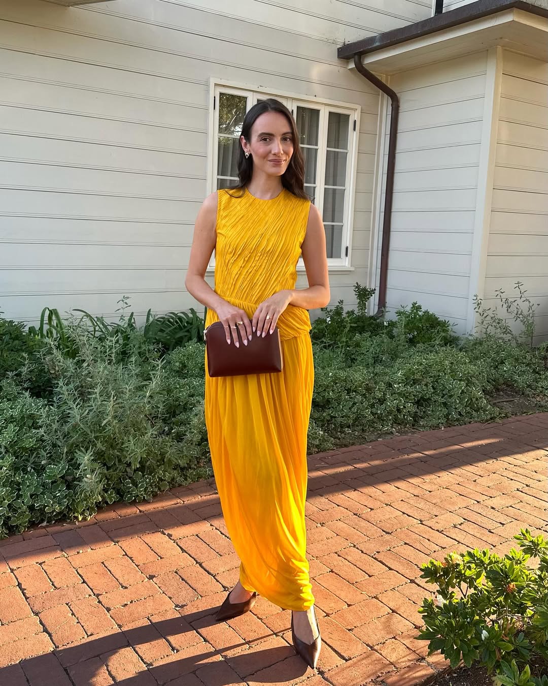 fashion influencer wearing a wedding guest dress