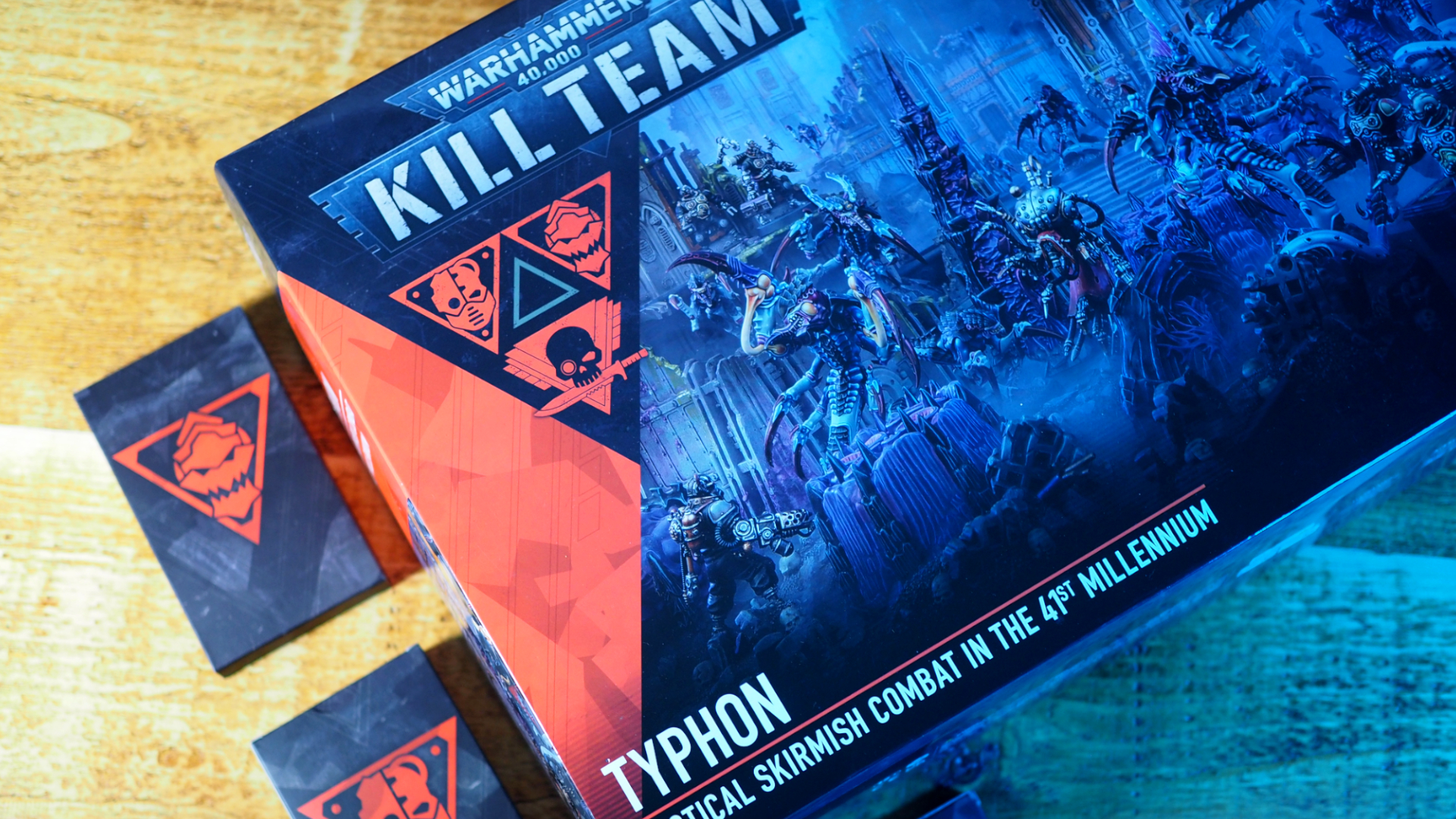 Kill Team: Typhon box and card decks on a wooden table