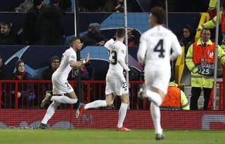 Kylian Mbappe celebrates scoring against Manchester United in the Champions League
