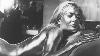 Shirley Eaton covered in gold on the set of James Bond film Goldfinger 1964