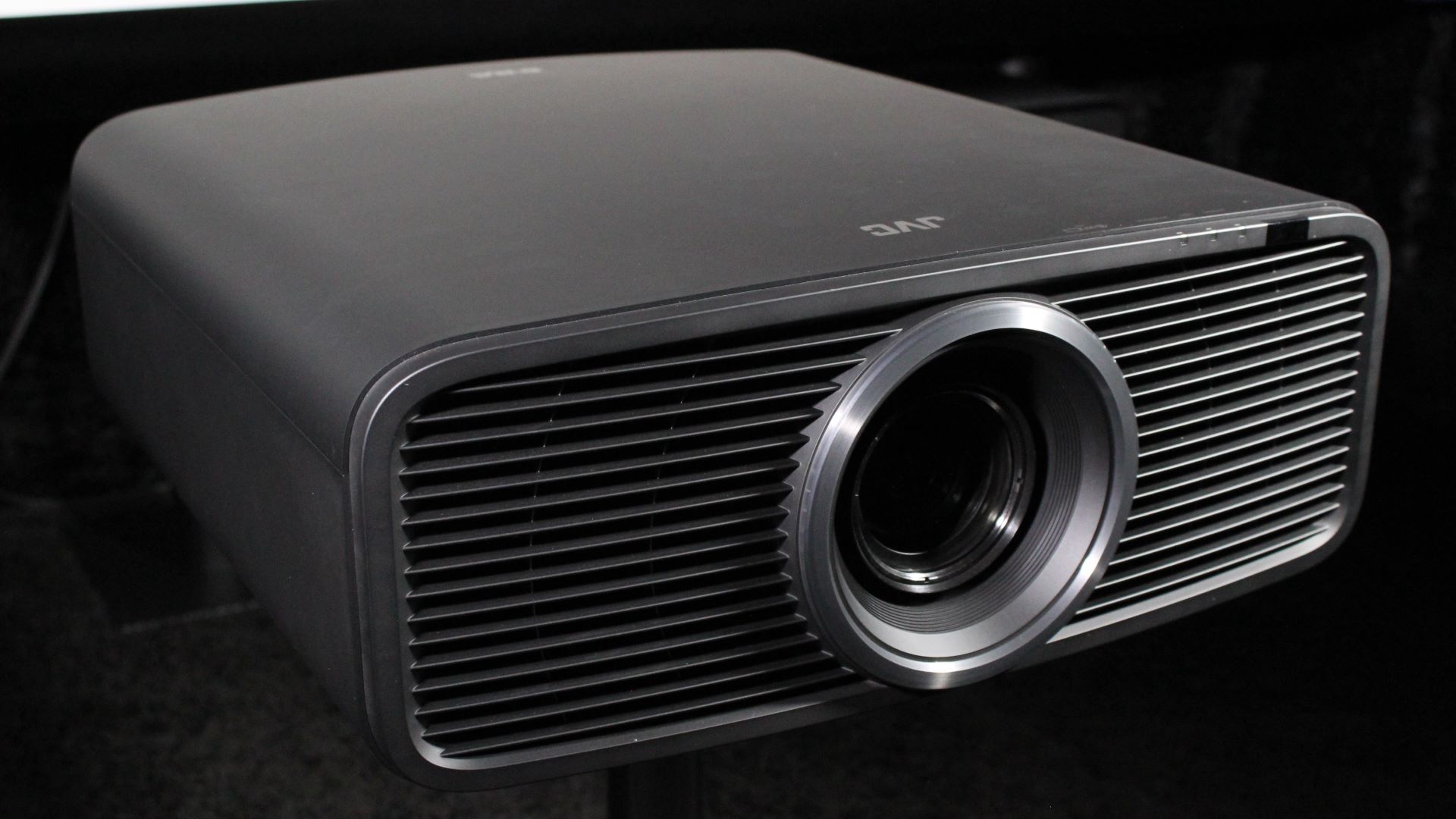 JVC DLA-NZ700 on table