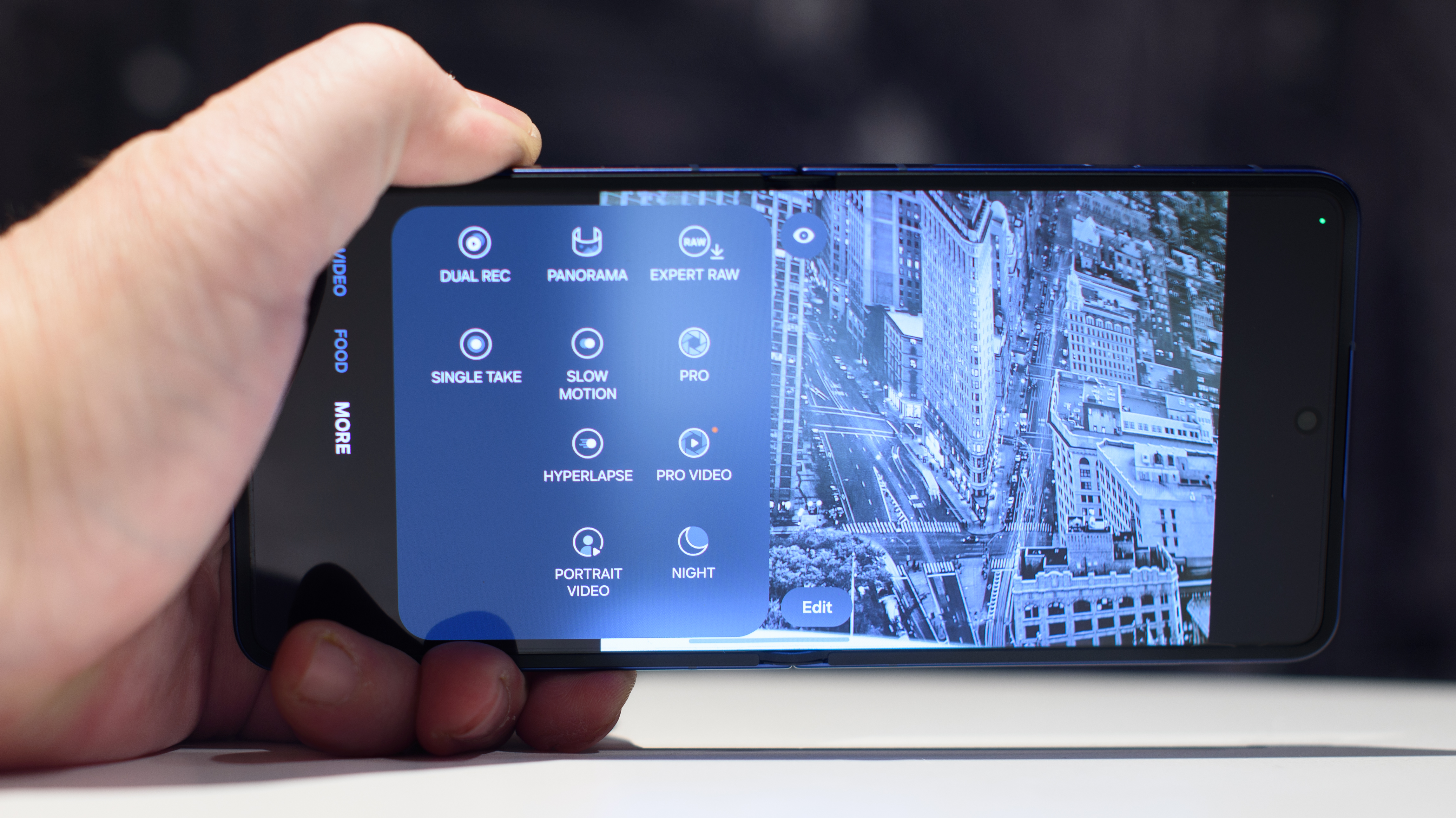 Samsung Galaxy Z Flip 7 in blue in hand showing the camera app interface