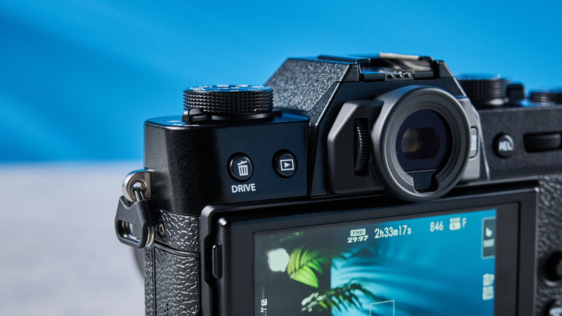 The Fujifilm X-T30 III viewfinder housing and rear left buttons