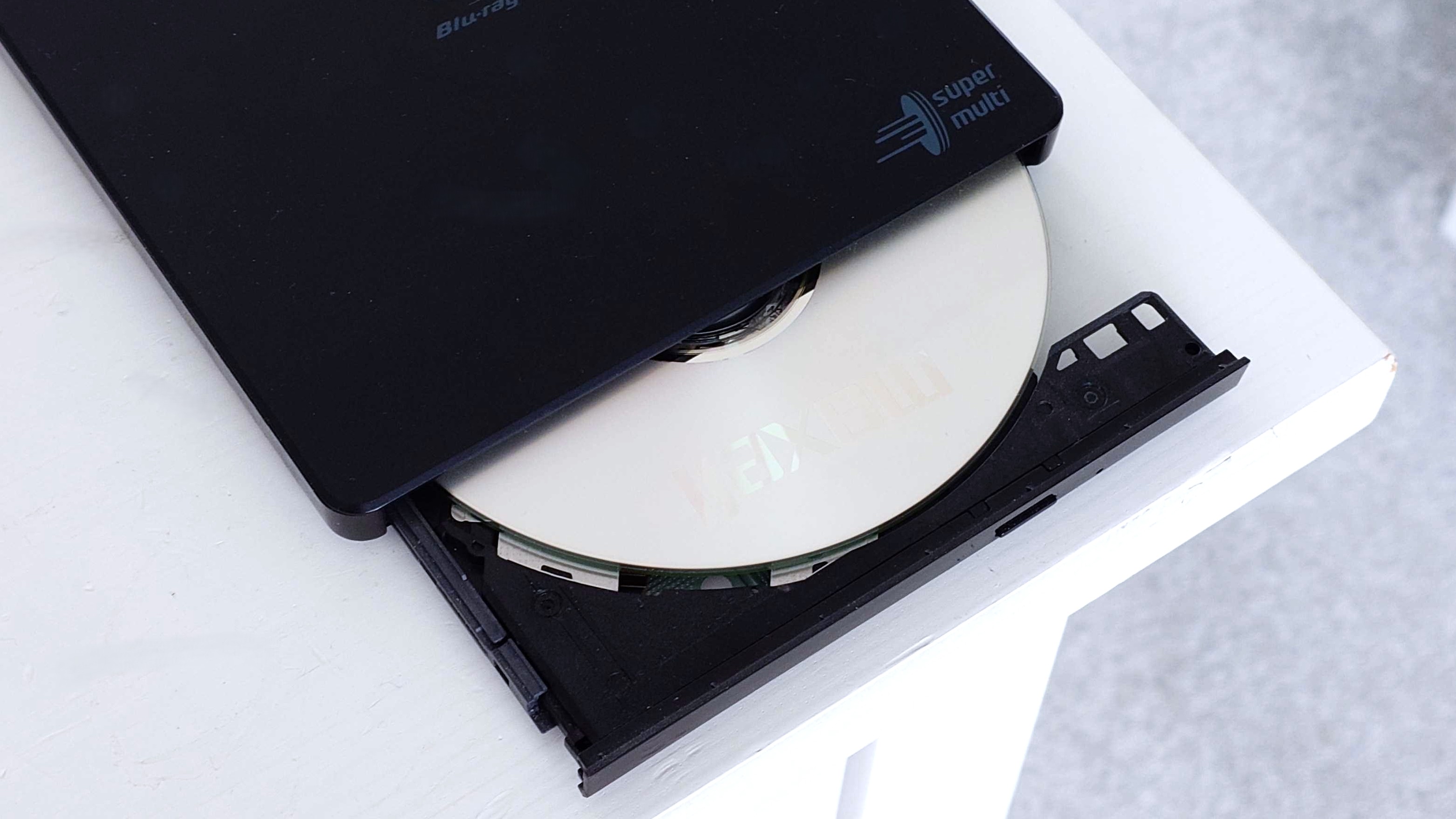 A photo of an LG-Hitachi Blu-ray drive open with a blank disc in the tray